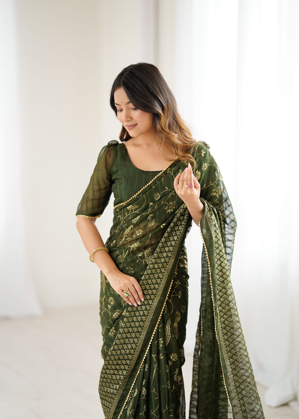 Elegant Mehandi Color Georgette Party Wear Saree with Foil Print & Fancy Zalar Lace