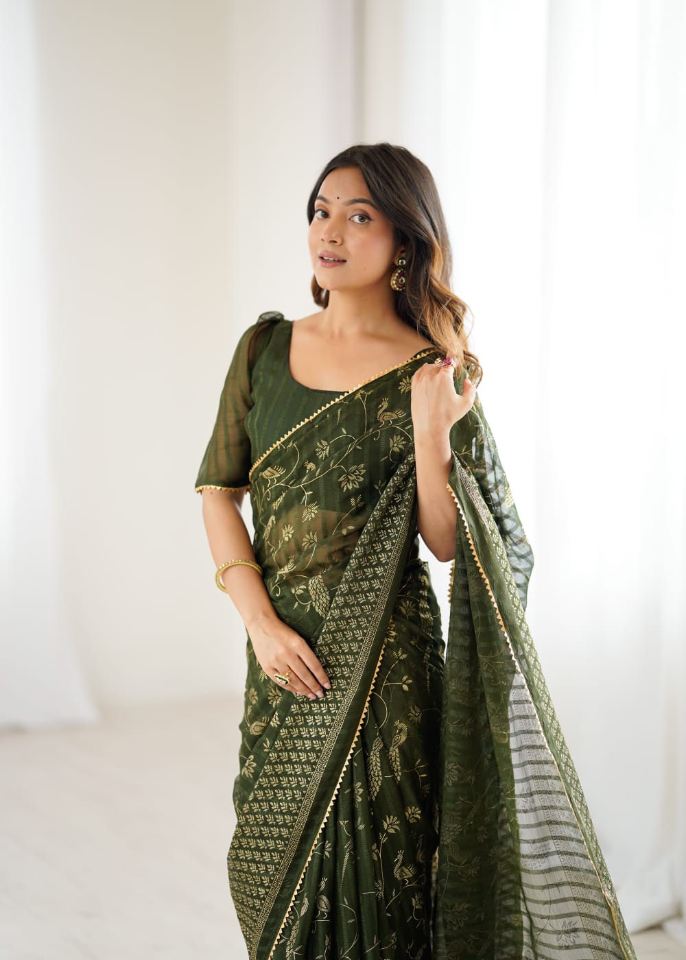 Elegant Mehandi Color Georgette Party Wear Saree with Foil Print & Fancy Zalar Lace