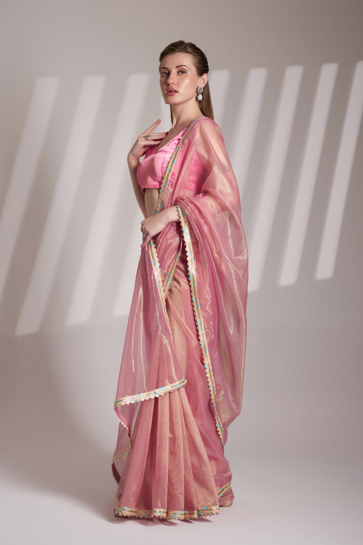 Light pink twill net saree with designer lace and unstitched blouse