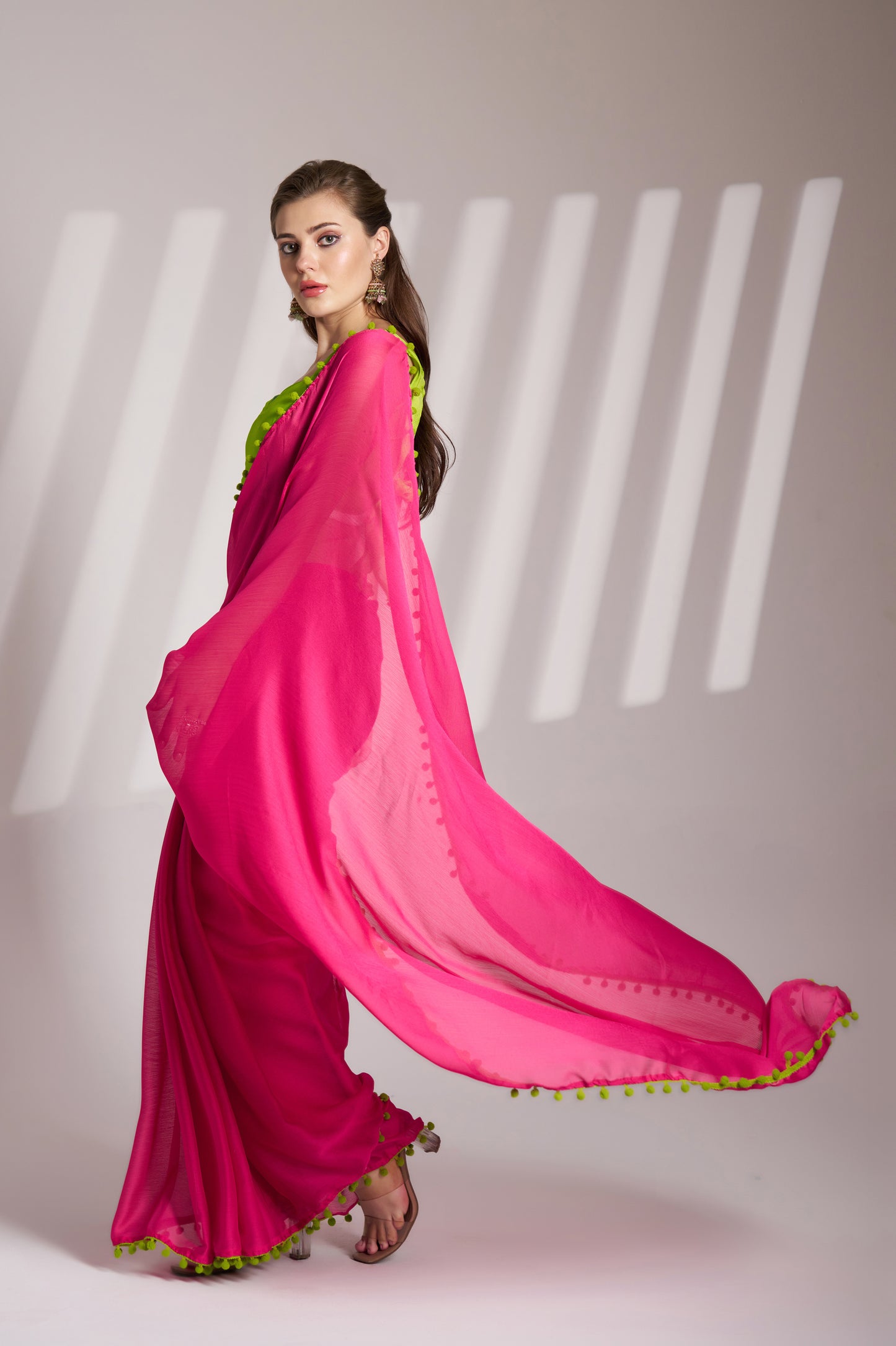 Pink color chiffon fabric saree with designer lace and unstitched blouse