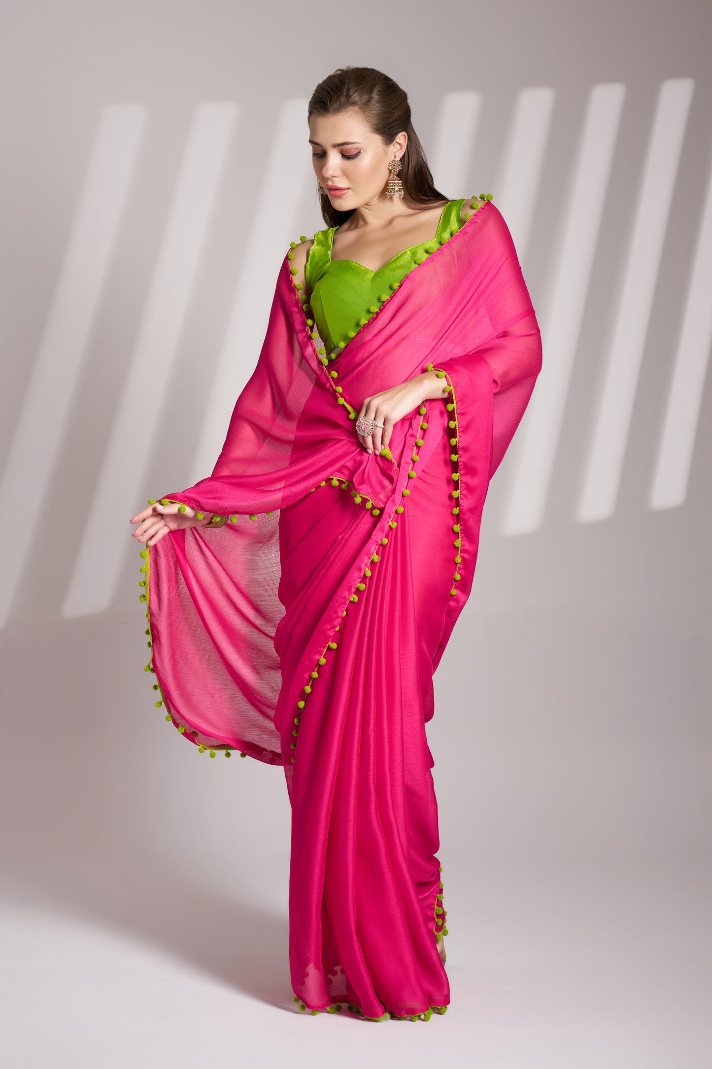 Pink color chiffon fabric saree with designer lace and unstitched blouse