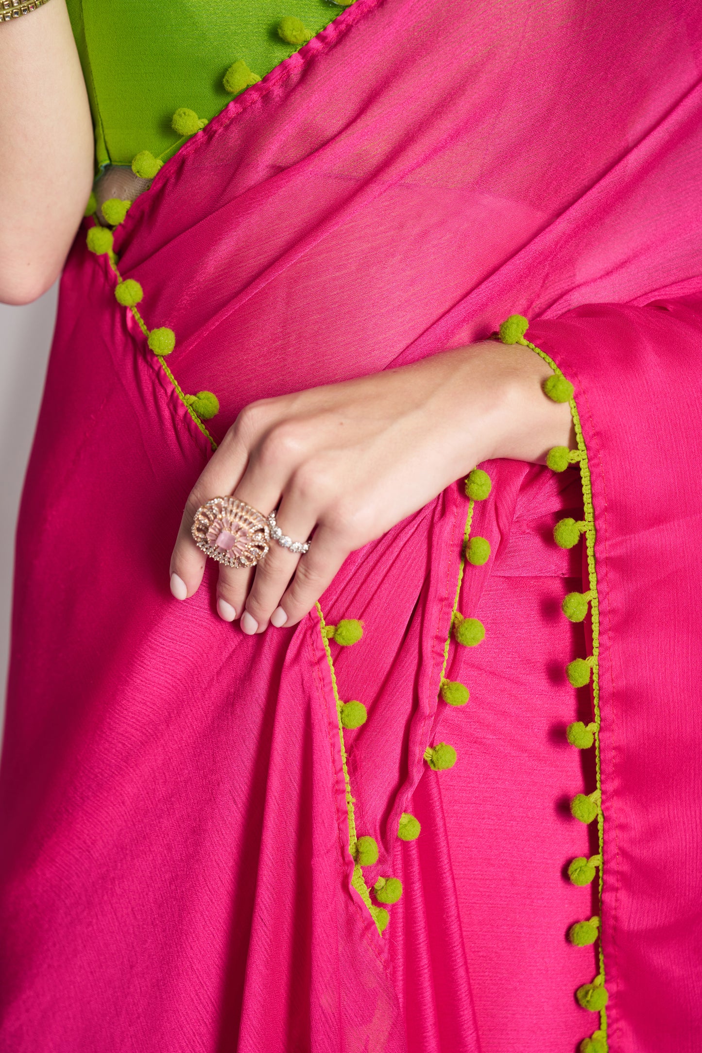 Pink color chiffon fabric saree with designer lace and unstitched blouse