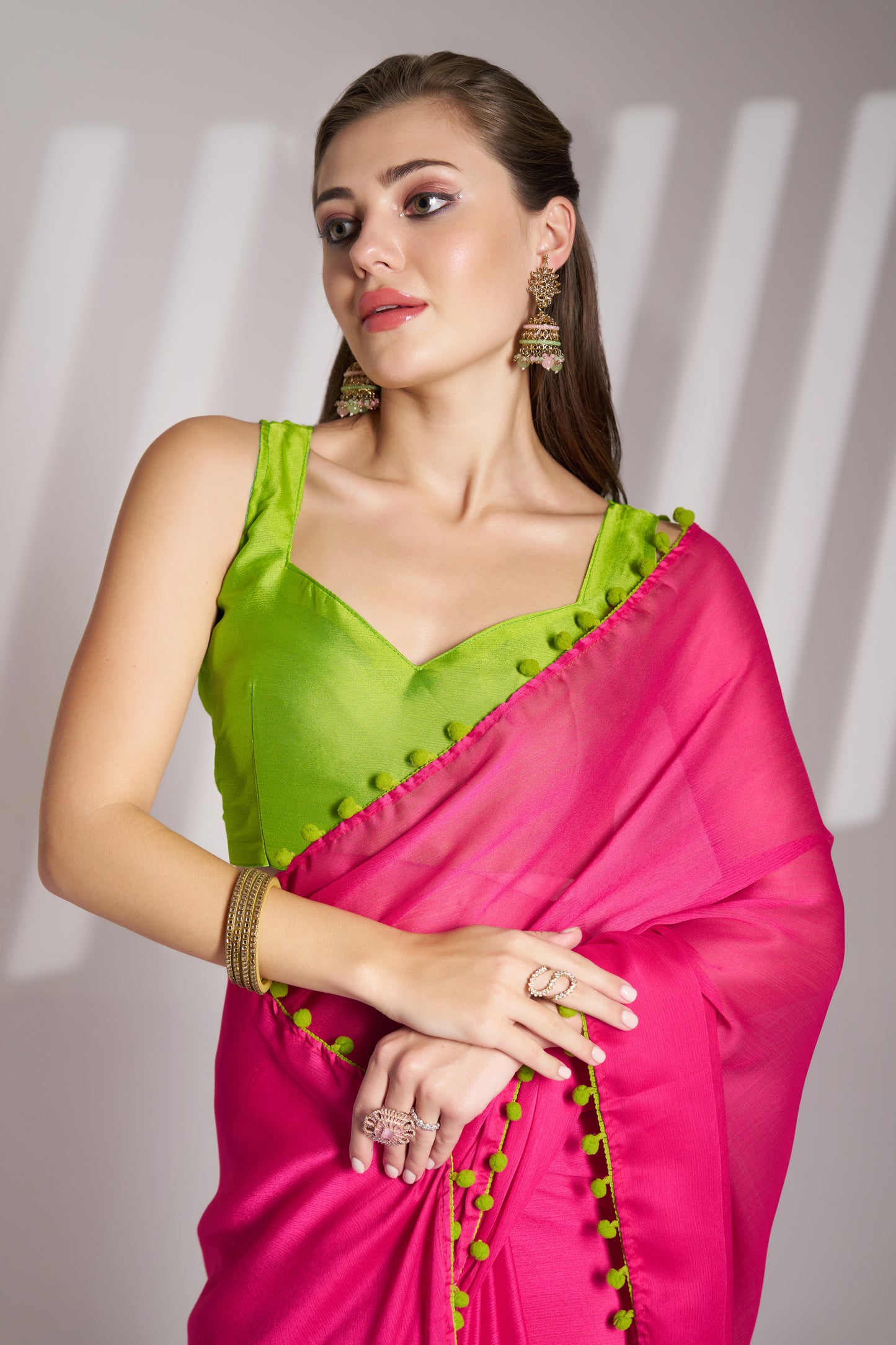Pink color chiffon fabric saree with designer lace and unstitched blouse