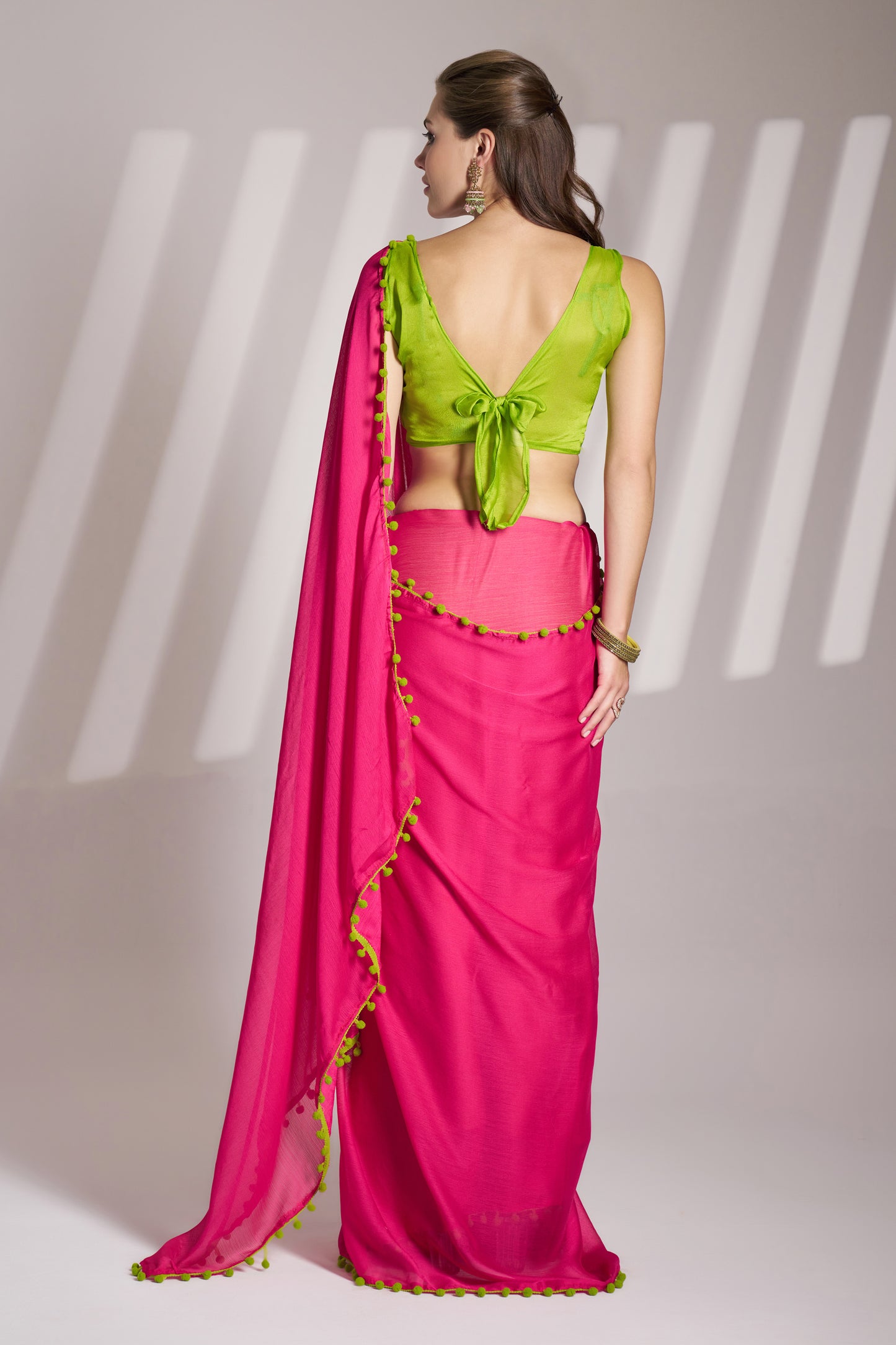 Pink color chiffon fabric saree with designer lace and unstitched blouse