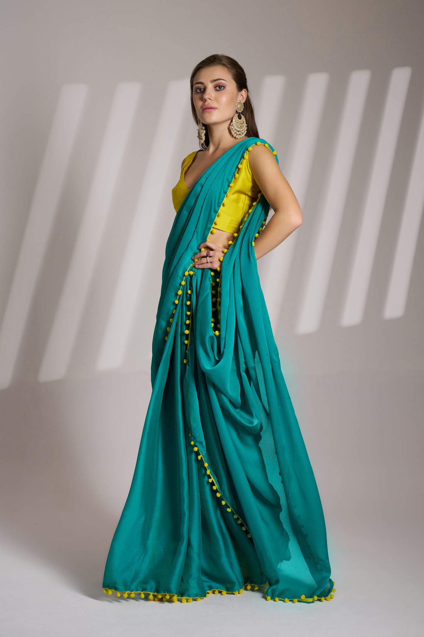 Sea Green color chiffon fabric saree with designer lace and unstitched blouse