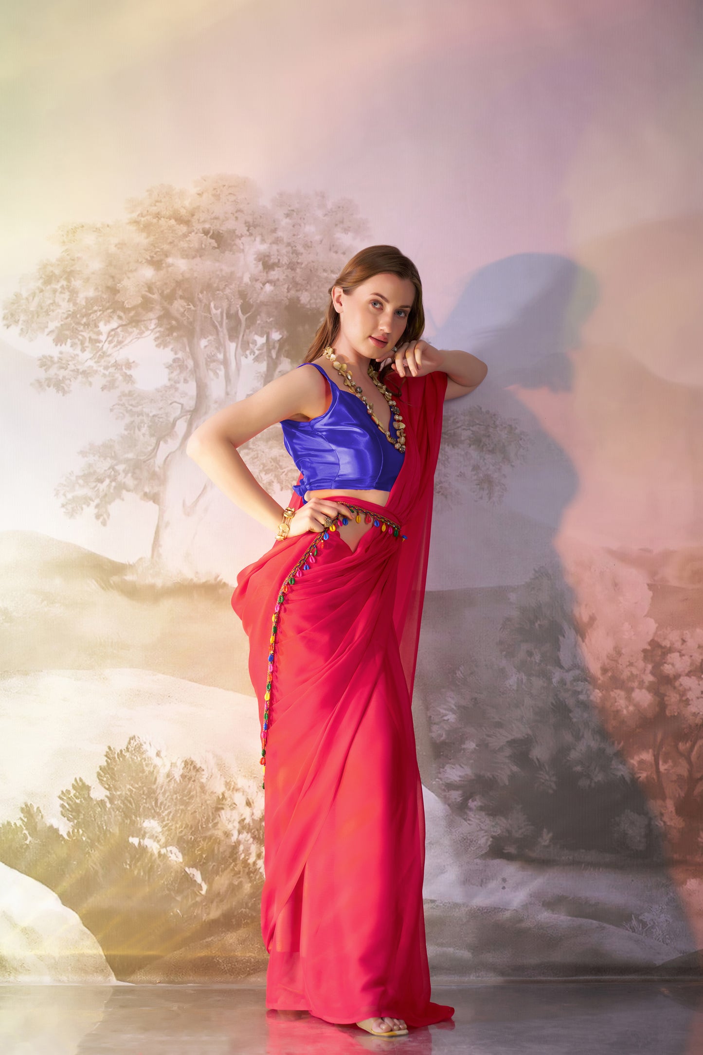 Red color chiffon fabric saree with designer lace and unstitched blouse