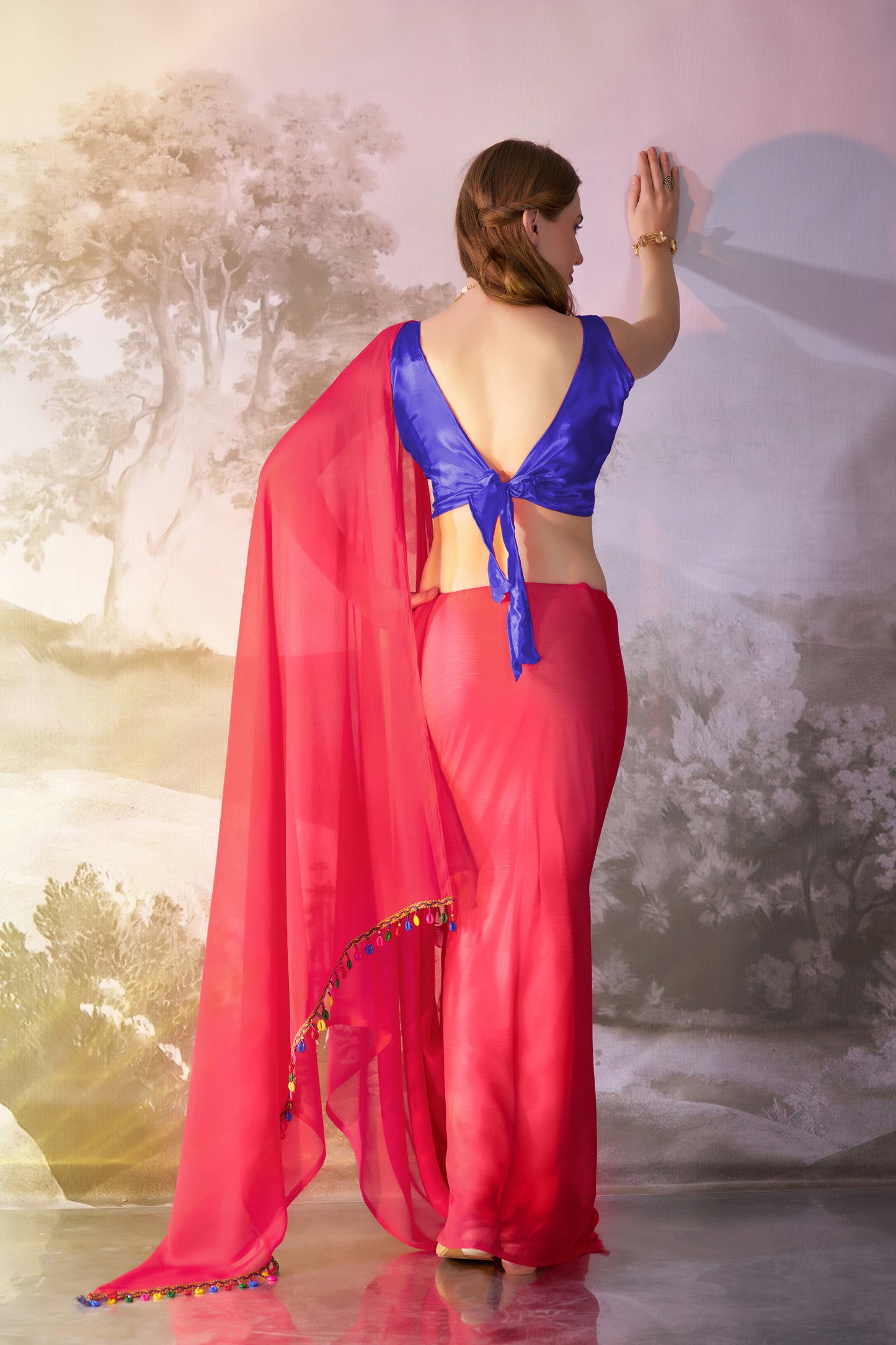 Red color chiffon fabric saree with designer lace and unstitched blouse