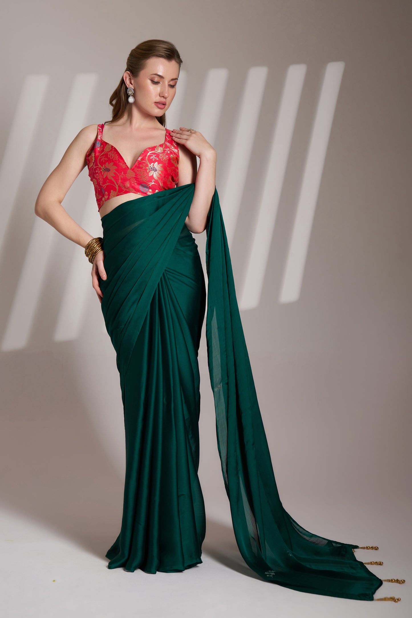 Green color chiffon fabric saree with designer lace and unstitched blouse