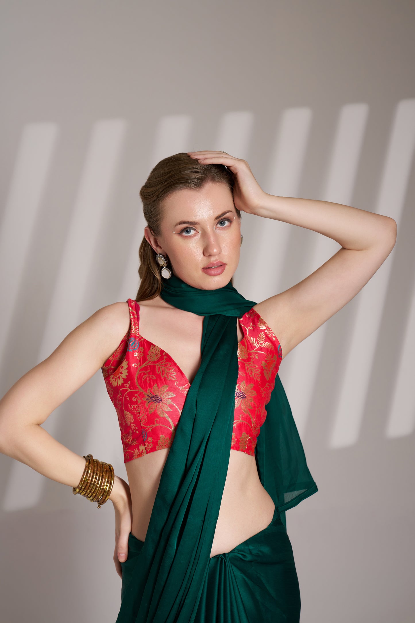 Green color chiffon fabric saree with designer lace and unstitched blouse