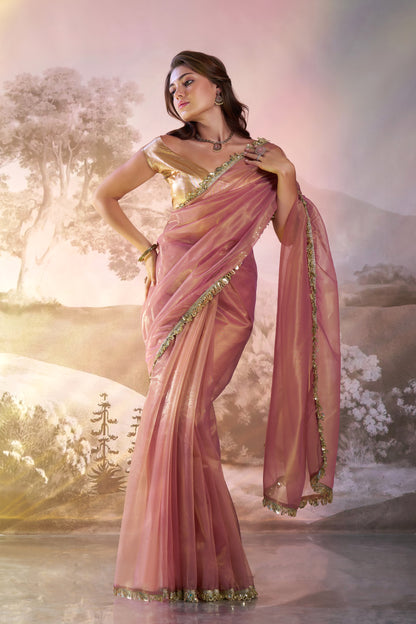 Light peach twill net saree with designer lace and unstitched blouse