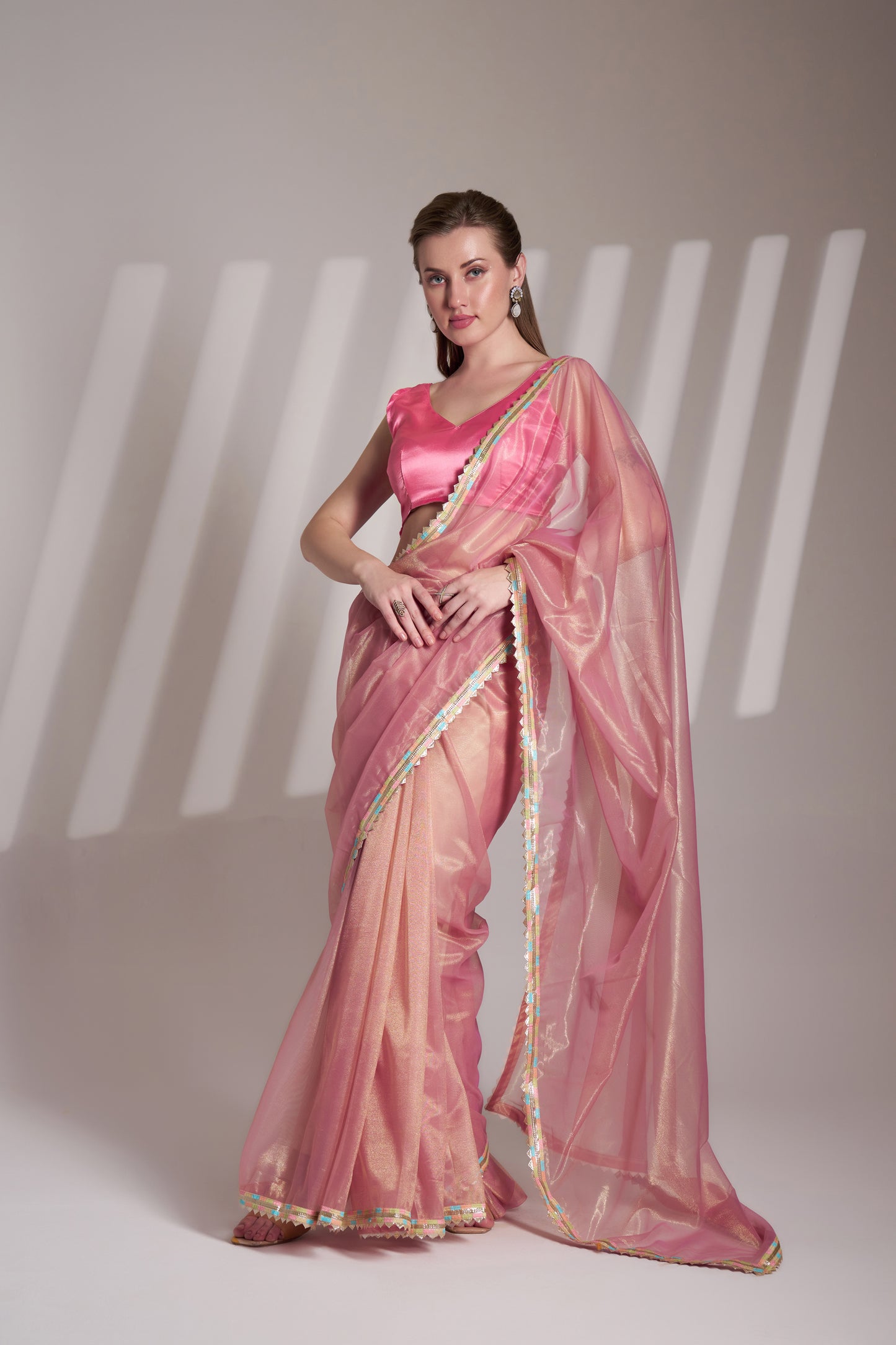 Light pink twill net saree with designer lace and unstitched blouse