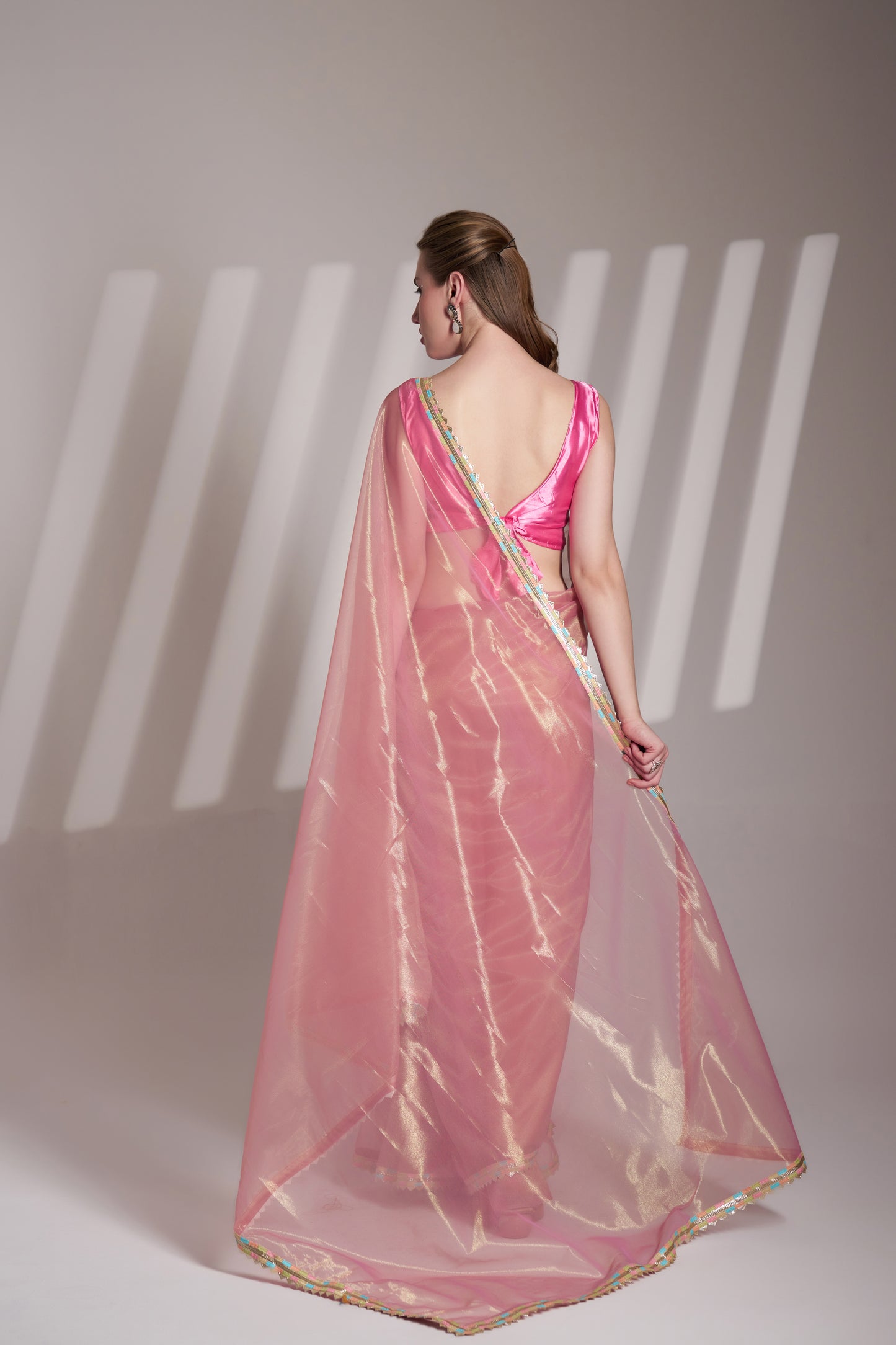 Light pink twill net saree with designer lace and unstitched blouse