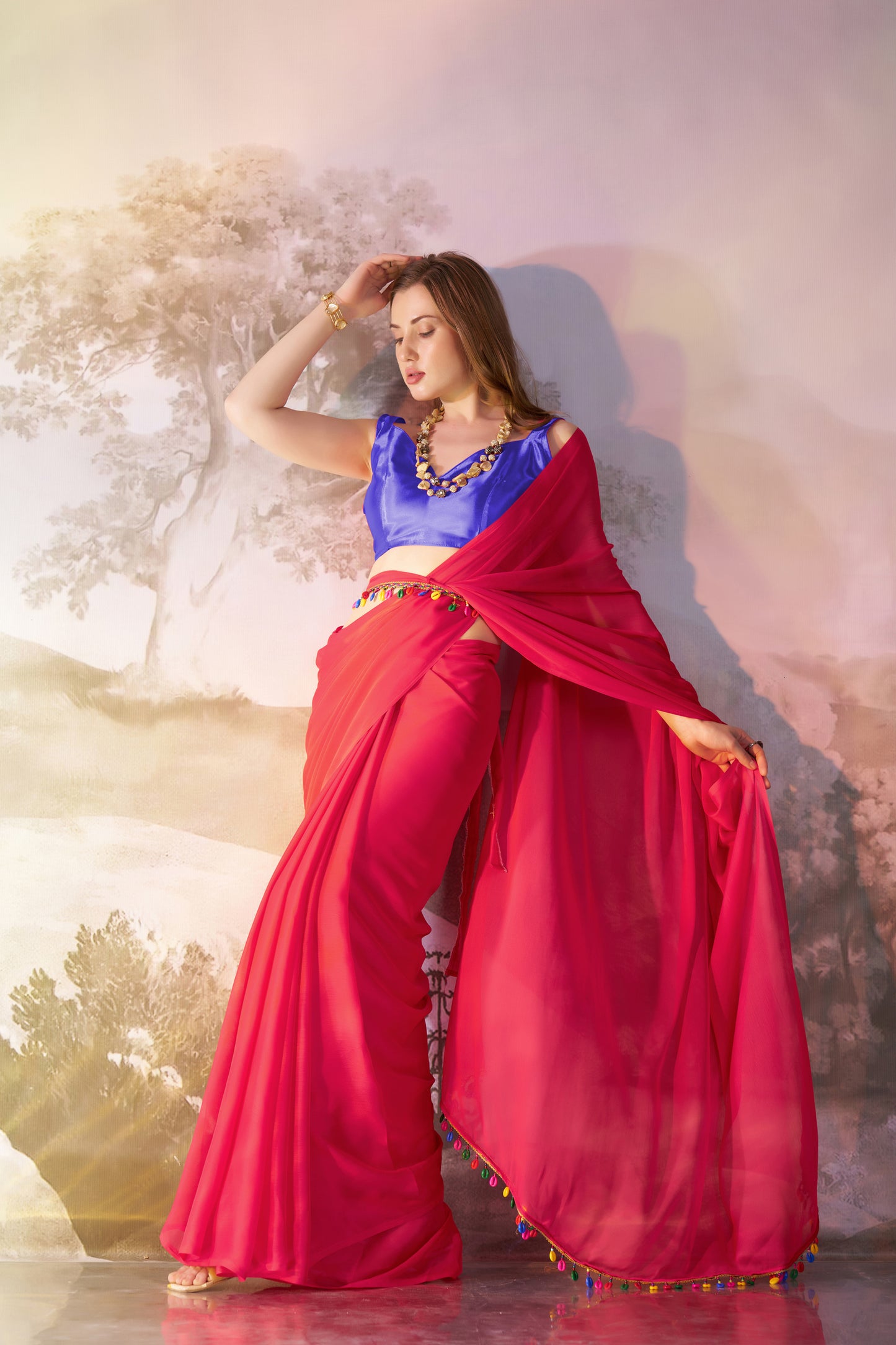 Red color chiffon fabric saree with designer lace and unstitched blouse