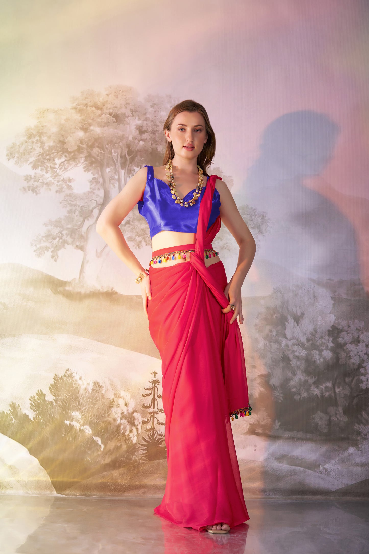 Red color chiffon fabric saree with designer lace and unstitched blouse